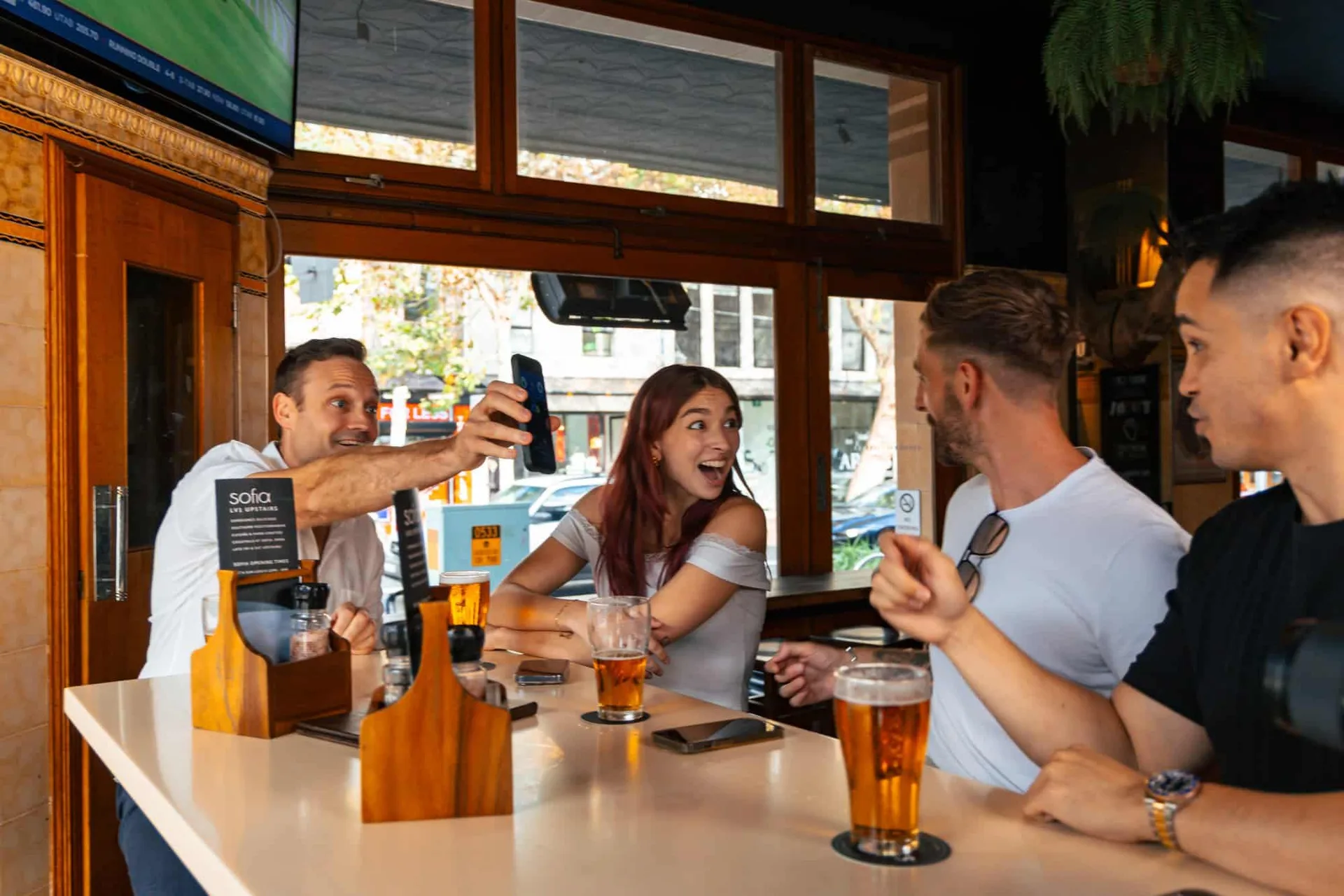 Mates at the pub watching Cricket