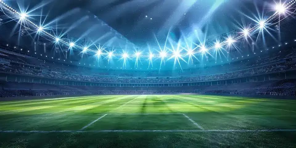 Stadium under floodlights at night